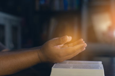 Close-up of hand holding book