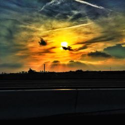 Scenic view of dramatic sky during sunset