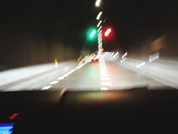 Blurred motion of car on road at night