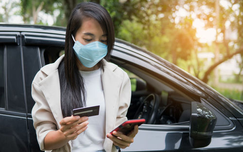 Man using mobile phone in car