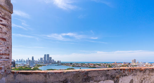 Buildings in city against sky