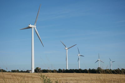 Wind turbines on field