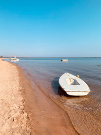 Scenic view of sea against clear blue sky