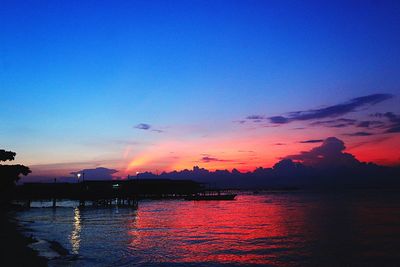 Scenic view of sea against romantic sky at sunset