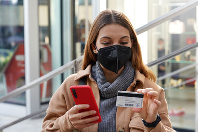 Young woman using mobile phone