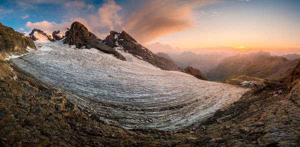 Panoramic view of mountains against sky during sunset