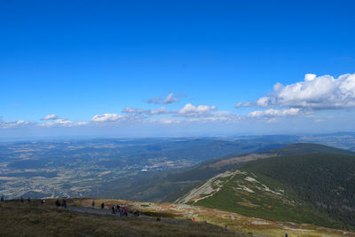 Scenic view of landscape against blue sky