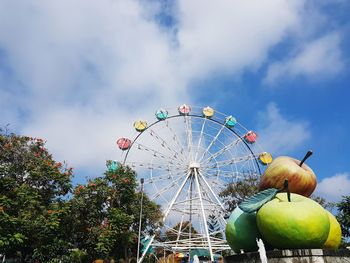 Low angle view of ferris wheel against sky