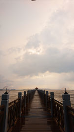 Pier over sea against sky