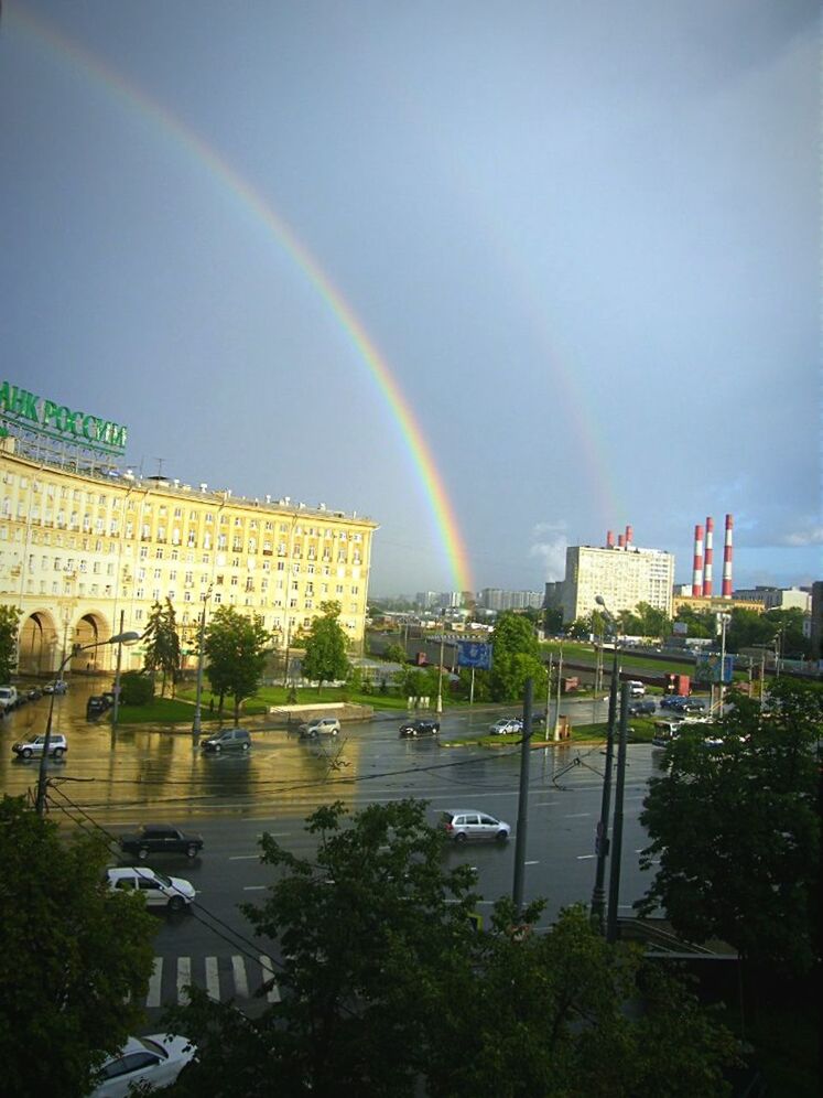 rainbow, architecture, building exterior, built structure, sky, multi colored, tree, cloud - sky, city, outdoors, cloudy, nature, panoramic, residential building, no people, weather, cloud, house, residential structure, low angle view