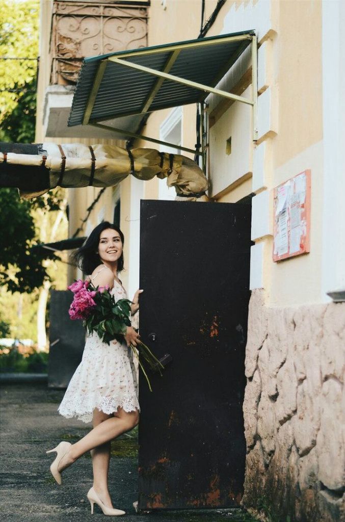 person, lifestyles, young adult, casual clothing, building exterior, full length, built structure, leisure activity, architecture, young women, standing, looking at camera, portrait, front view, smiling, elementary age, three quarter length, happiness