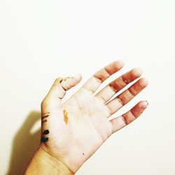 Close-up of woman hand over white background