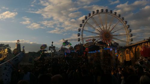 Low angle view of ferris wheel against sky