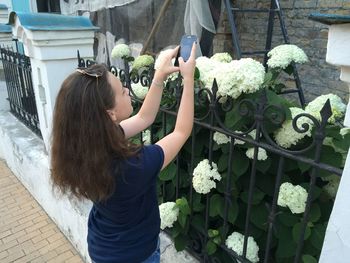 Woman looking at flowers