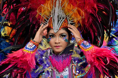 Portrait of confident woman wearing colorful costume