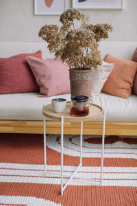 Close-up of vase on table at home