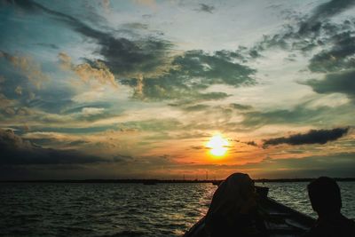 Scenic view of sea against sky at sunset