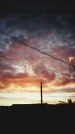 Low angle view of cloudy sky at sunset