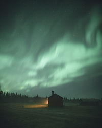 Scenic view of field against sky at night