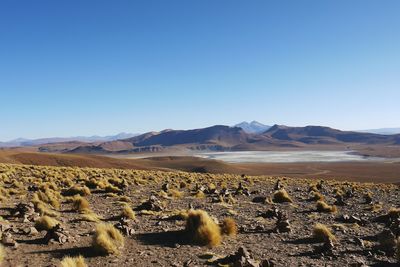 Scenic view of dramatic landscape against clear blue sky