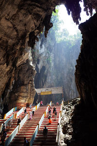 People walking on steps at batu caves