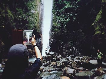 Young man holding camera