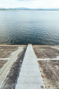 High angle view of sea shore against sky