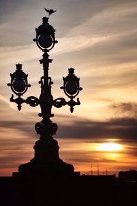 Low angle view of street light against sky