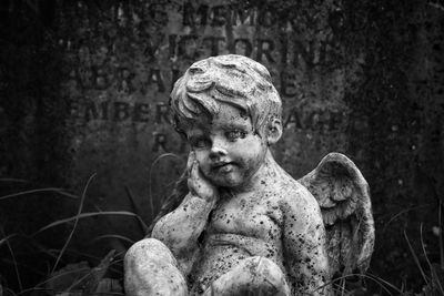 Close-up of statue in cemetery