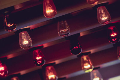 Full frame shot of illuminated light bulbs on ceiling