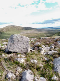 Rock formations on landscape against sky