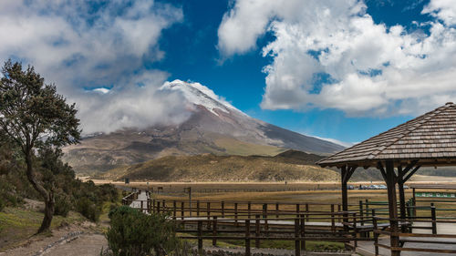 Scenic view of mountains against cloudy sky