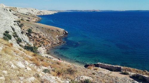 High angle view of sea against blue sky