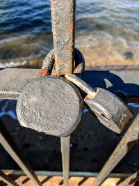 Close-up of padlocks on metal