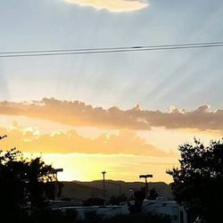 Scenic view of cloudy sky at sunset