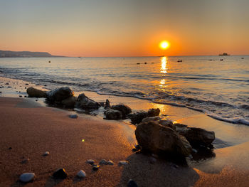 Scenic view of sea against sky during sunset