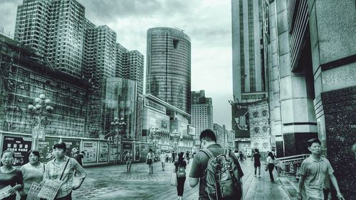 Buildings in city against sky