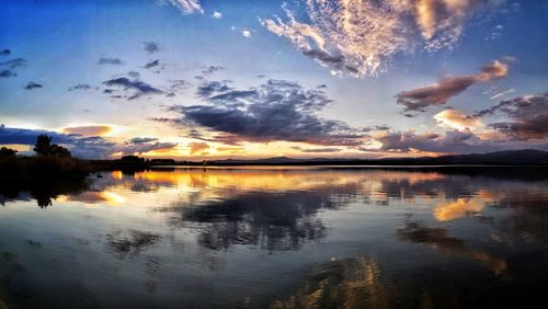 Scenic view of lake against sky during sunset