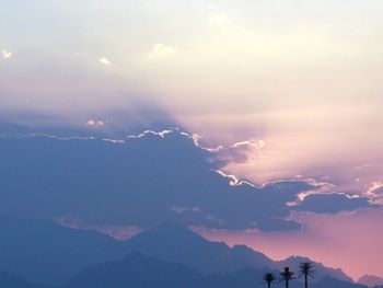 Low angle view of silhouette mountains against sky during sunset