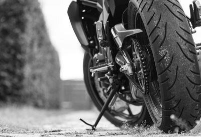 Close-up of motorcycle on road