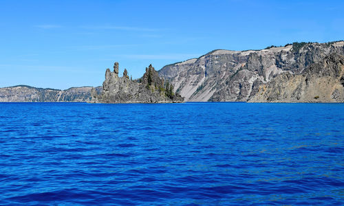 Scenic view of sea against blue sky