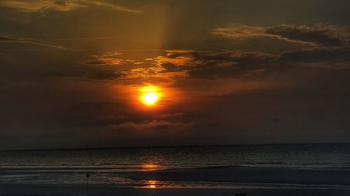 Scenic view of sea against sky at sunset