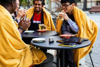 People sitting on table in restaurant