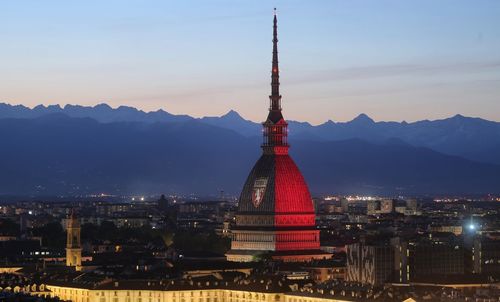 View of illuminated city at sunset