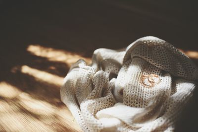 Close-up view of wedding rings with wool on table