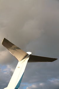 Low angle view of airplane flying in sky