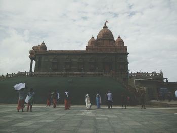 Tourists against clear sky