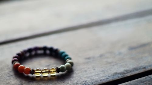 Close-up of bracelet on wooden table