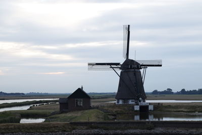 Scenic view of windmill against sky