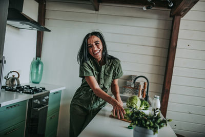 Smiling woman standing at home
